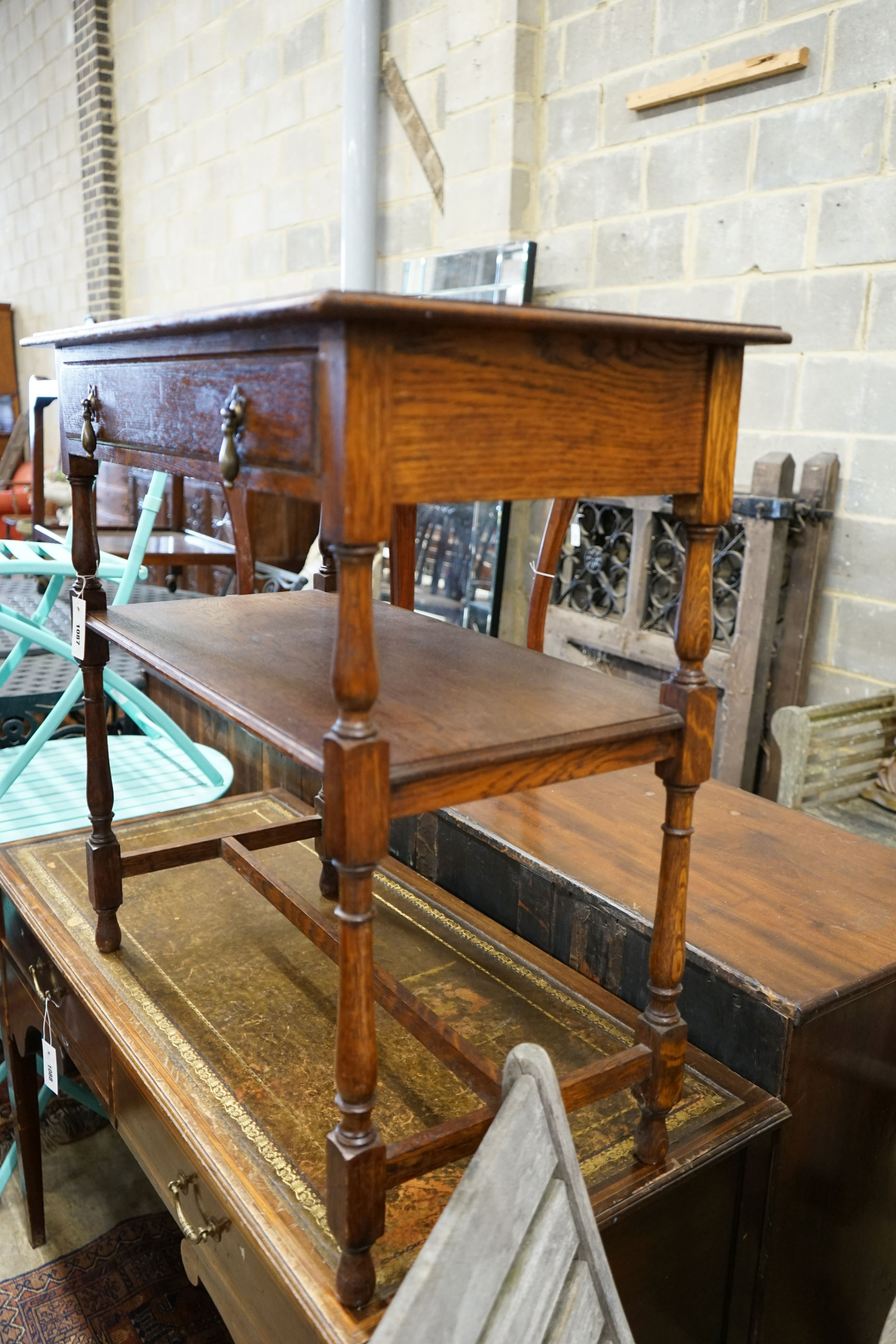 A Liberty style hexagonal oak two tier table, width 47cm, height 71cm together with a rectangular oak two tier table